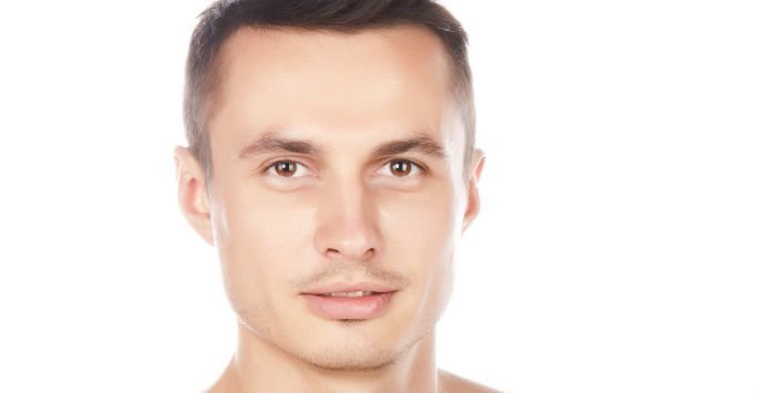 Man with brown eyes against white background