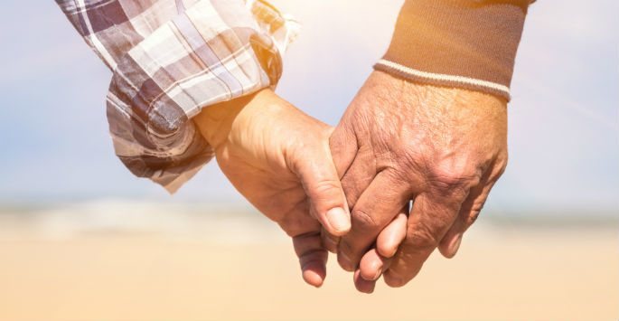 Photo of older couples' holding hands