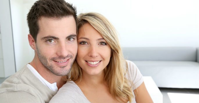 Photo of a beautiful young couple, both have thick hair